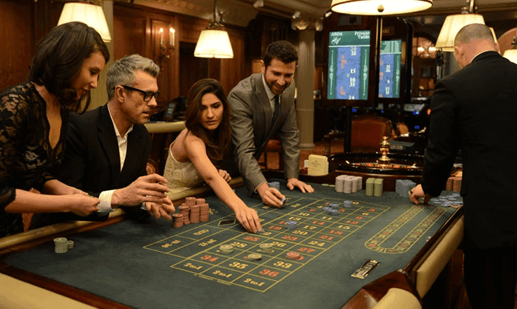 A group of people playing roulette at the Les Ambassadeurs casino in Mayfair, London.