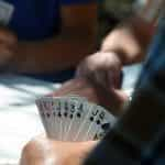 A group of people playing cards.