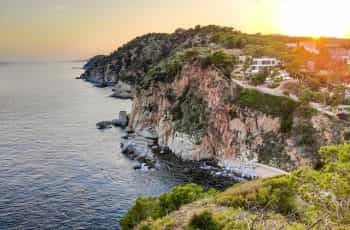 An aerial photo of the coastline at Catalonia at sunset.